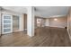 Open-concept layout with hardwood floors flowing into a modern kitchen at 10216 Regal Dr # 208, Largo, FL 33774