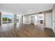 Bright open living room flows seamlessly into a modern kitchen with stainless steel appliances at 10216 Regal Dr # 208, Largo, FL 33774