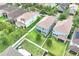 This aerial view highlights the homes in the neighborhood, landscaping, and fencing at 1028 Oliveto Verdi Ct, Brandon, FL 33511