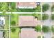 Bird's eye view of neighborhood, showcasing the tile roofs, landscaping, and street layout at 1028 Oliveto Verdi Ct, Brandon, FL 33511