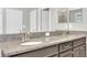 Bathroom features double sinks, granite countertop, and a large mirror at 1028 Oliveto Verdi Ct, Brandon, FL 33511