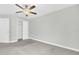 Bedroom with a ceiling fan, gray walls, carpet, and white trim at 1028 Oliveto Verdi Ct, Brandon, FL 33511