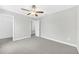 This bedroom has neutral walls, carpet, and a ceiling fan at 1028 Oliveto Verdi Ct, Brandon, FL 33511