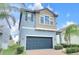 Charming two-story home featuring a paved driveway and lush landscaping at 1028 Oliveto Verdi Ct, Brandon, FL 33511
