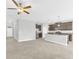 Bright, open kitchen with stainless steel appliances, tile floors, and a large center island at 1028 Oliveto Verdi Ct, Brandon, FL 33511