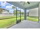 Enjoy outdoor living on this screened-in patio with views of the lush backyard at 1028 Oliveto Verdi Ct, Brandon, FL 33511