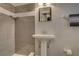Bathroom featuring a vessel sink, modern fixtures, and tiled shower at 11188 64Th Ter, Seminole, FL 33772