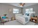 Serene bedroom with neutral tones, wood-look flooring, and ample natural light at 11188 64Th Ter, Seminole, FL 33772
