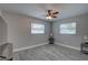 This well-lit bedroom boasts wood-look flooring and large windows at 11188 64Th Ter, Seminole, FL 33772