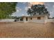 The property features neutral siding, gravel landscaping, and a concrete patio creating a clean and private yard at 11188 64Th Ter, Seminole, FL 33772
