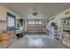 Spacious garage with ample storage, featuring a white garage door, gray flooring, and organizational options at 11188 64Th Ter, Seminole, FL 33772