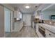 Updated kitchen featuring white cabinets, granite counters, and stainless steel appliances at 11188 64Th Ter, Seminole, FL 33772