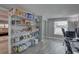 This is a pantry area with shelving units filled with various goods, including storage shelves with goods at 11188 64Th Ter, Seminole, FL 33772