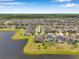 Spacious homes with beautiful lake views, well-maintained lawns, and lush landscaping, creating a picturesque neighborhood at 11878 Thicket Wood Dr, Riverview, FL 33579