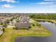Aerial view of backyard with water view in residential neighborhood at 11878 Thicket Wood Dr, Riverview, FL 33579