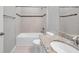 Bathroom with tub, shower, tile surround, granite vanity, and tile flooring at 11878 Thicket Wood Dr, Riverview, FL 33579