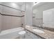 Bathroom with tub, shower, tile surround, granite vanity, and tile flooring at 11878 Thicket Wood Dr, Riverview, FL 33579