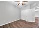 Bedroom with hardwood flooring, a ceiling fan, and a closet at 11878 Thicket Wood Dr, Riverview, FL 33579