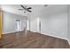 Bedroom featuring wood floors and neutral colored walls with an external door to the back of the property at 11878 Thicket Wood Dr, Riverview, FL 33579