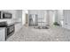 Bright kitchen with stainless steel appliances, granite countertops and a spacious island at 11878 Thicket Wood Dr, Riverview, FL 33579