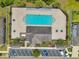 Aerial view of community pool and lounge area with chairs and tables at 11878 Thicket Wood Dr, Riverview, FL 33579