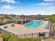 Community pool area featuring lounge chairs, tables, and shade at 11878 Thicket Wood Dr, Riverview, FL 33579