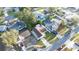 Aerial view of a residential property in a well-established neighborhood with mature trees and greenery at 11991 104Th Ave, Seminole, FL 33778