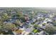 Drone shot showcases the home nestled in a tranquil, tree-lined suburban neighborhood at 11991 104Th Ave, Seminole, FL 33778