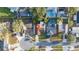 Aerial view of the property in a neighborhood with mature trees and manicured lawns at 11991 104Th Ave, Seminole, FL 33778