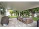 Backyard patio featuring comfortable seating and a grilling area, perfect for outdoor entertaining at 11991 104Th Ave, Seminole, FL 33778