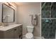 Well-maintained bathroom features tiled shower with showerhead, vanity with stylish mirror, and a standard toilet at 11991 104Th Ave, Seminole, FL 33778