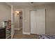 This is an additional view of the bedroom including a closet and a partial view of the bed with sports themed covers at 11991 104Th Ave, Seminole, FL 33778