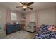 Bedroom with a ceiling fan, closet and two windows allowing for natural light at 11991 104Th Ave, Seminole, FL 33778