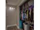 Walk-in closet featuring ample storage, hanging racks, shelving, and organized space for clothes, luggage and shoes at 11991 104Th Ave, Seminole, FL 33778