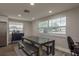 Bright dining area with a large window, a rustic table with benches, and modern decor at 11991 104Th Ave, Seminole, FL 33778