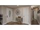 Inviting foyer featuring a decorative front door, console table with drawers, and stylish flooring at 11991 104Th Ave, Seminole, FL 33778