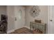 Welcoming entryway with a decorative door, stylish console table, and elegant wall decor at 11991 104Th Ave, Seminole, FL 33778