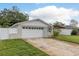 Charming single-story home with a well-maintained lawn, attached garage, and inviting front porch at 11991 104Th Ave, Seminole, FL 33778