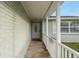 Close up of the front porch with tile work and an inviting front door at 11991 104Th Ave, Seminole, FL 33778