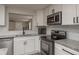 Well-appointed kitchen with subway tile backsplash and stainless steel appliances at 11991 104Th Ave, Seminole, FL 33778