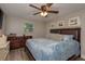 Comfortable main bedroom with hardwood floors, ample natural light, and neutral decor at 11991 104Th Ave, Seminole, FL 33778
