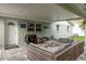 Outdoor patio features comfortable wicker seating, a grill, and a brick paver floor at 11991 104Th Ave, Seminole, FL 33778