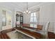 Dining area with a wooden table, bench seating, and stylish decor at 12009 Whistling Wind Dr, Riverview, FL 33569