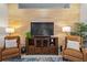 Living room with a wooden accent wall and matching furniture at 12009 Whistling Wind Dr, Riverview, FL 33569