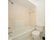 A clean, tiled bathroom features a shower-tub combo and standard toilet at 12780 N 57Th St, Tampa, FL 33617