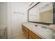 Bathroom vanity with sink, framed mirror, and wooden drawers at 12780 N 57Th St, Tampa, FL 33617