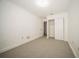 Clean bedroom with neutral carpet and a large closet is move-in ready and waiting for personal touch at 12780 N 57Th St, Tampa, FL 33617