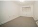 Neat bedroom with neutral carpet and a bright window with blinds, offers comfort and privacy at 12780 N 57Th St, Tampa, FL 33617