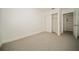 Clean bedroom with neutral carpet and closet space provides a blank canvas to create your personal space at 12780 N 57Th St, Tampa, FL 33617