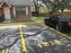 Condo exterior with assigned parking and manicured lawns and mature shade trees nearby at 12780 N 57Th St, Tampa, FL 33617